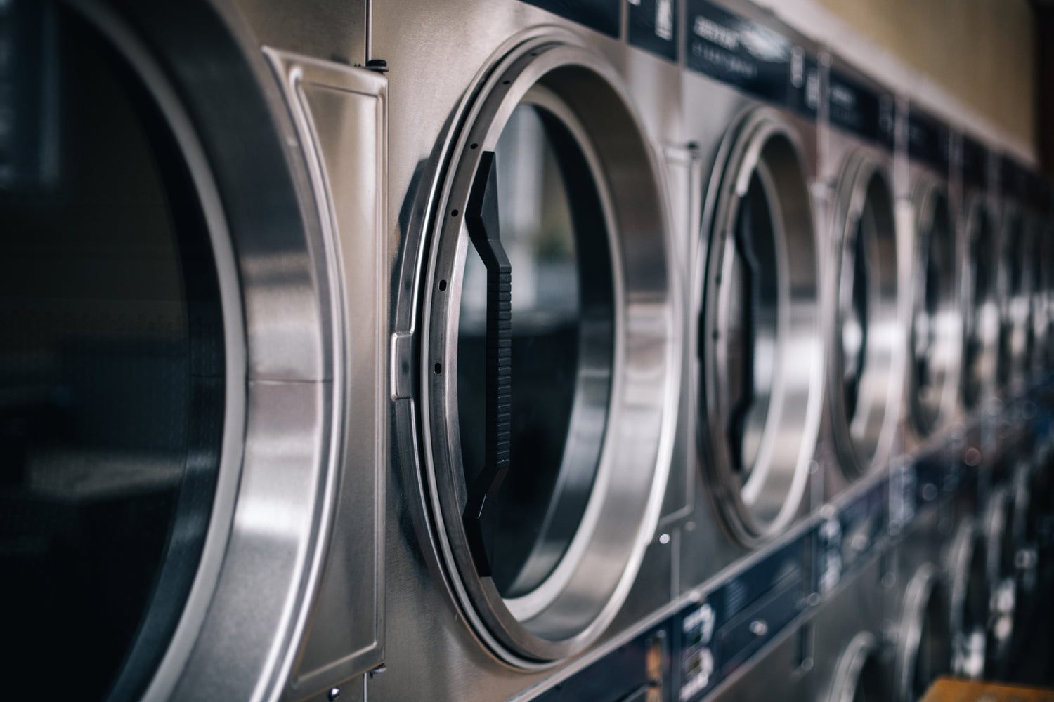 A row of washing machines at a laundrette